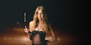 Woman holding a rifle with a dark background and 'Beach Club' text.