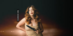 Woman holding a gun with a dark background