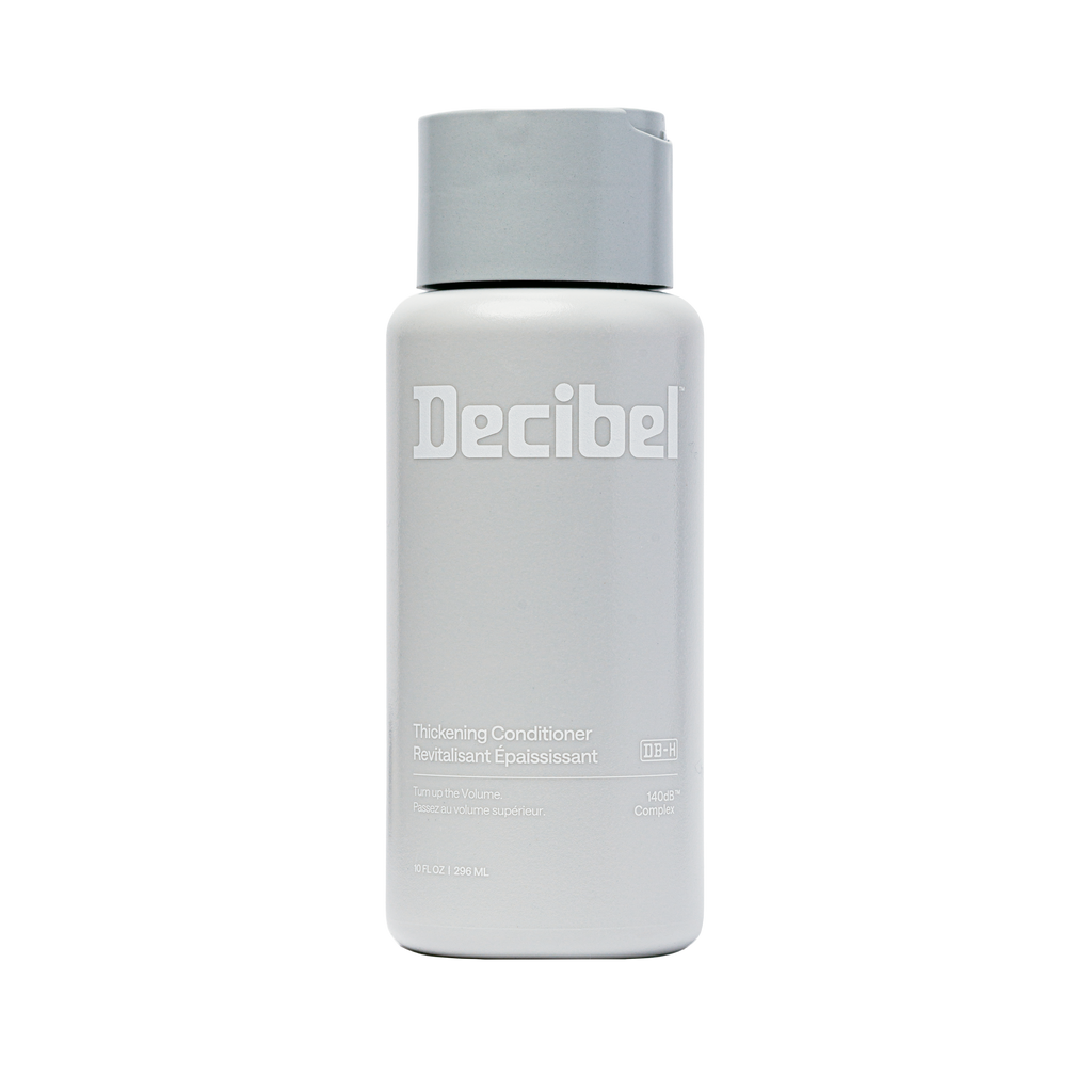 A Decibel brand haircare bottle containing Thickening Conditioner, shown against a plain white background.