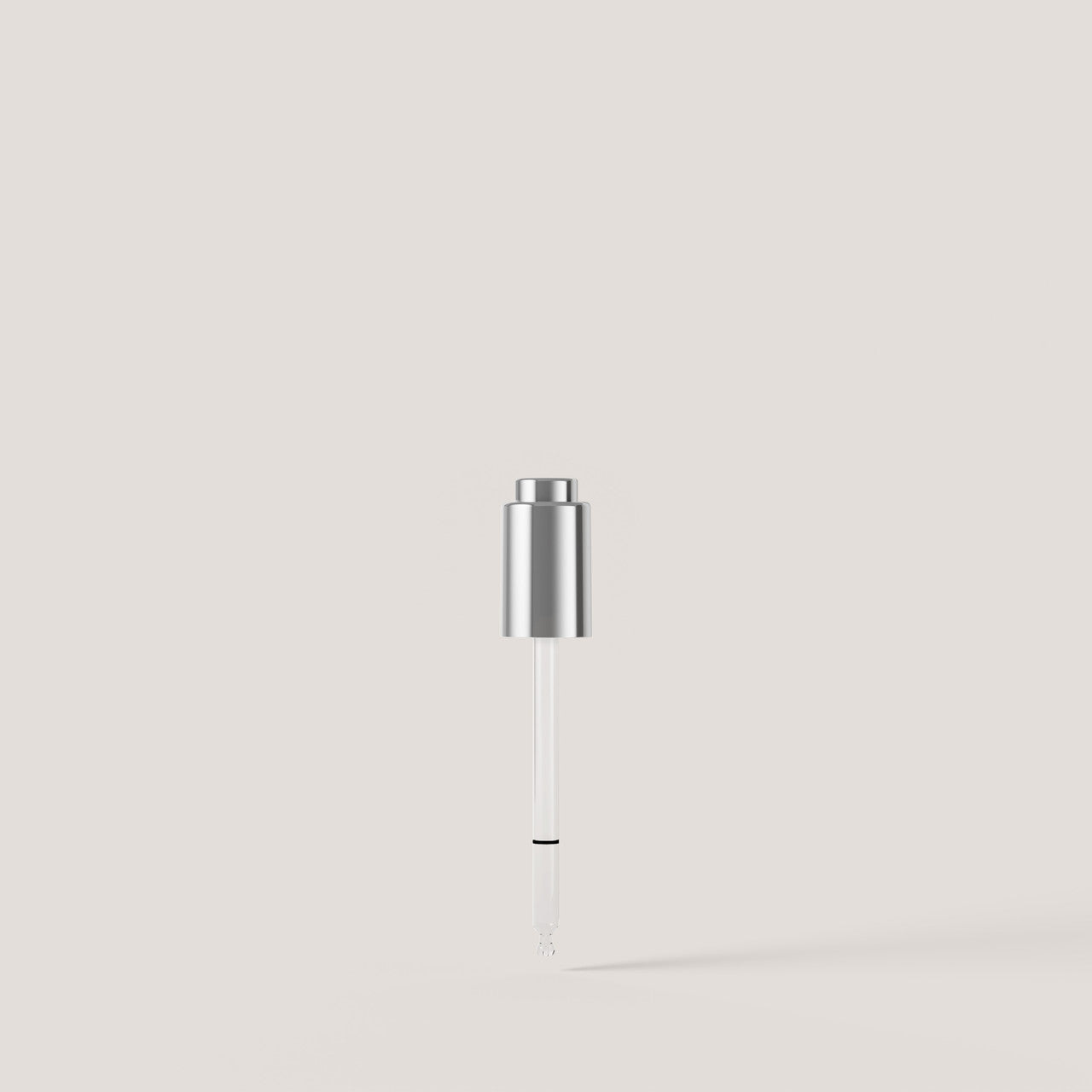 A silver cylindrical cosmetic applicator with a clear wand and fine brush tip, centered against a solid light beige background.